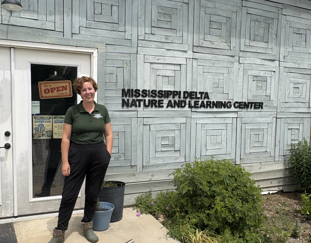 A woman standing outside the Mississippi Delta Nature and Learning Center