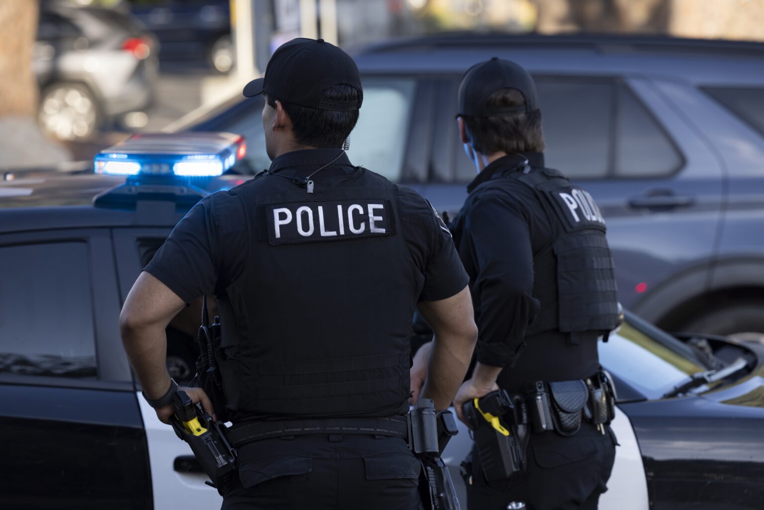 Police,Cars,And,Officers,Arrive,On,Scene,Of,An,Emergency.