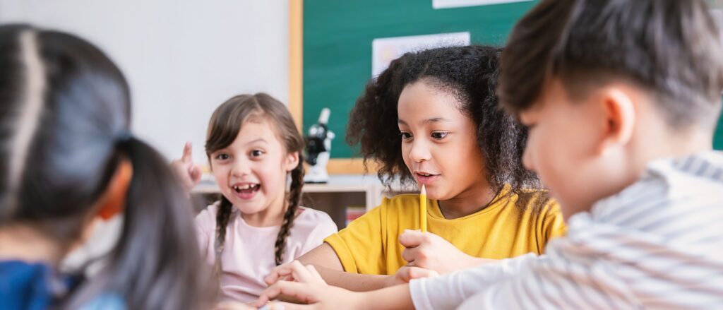 Children working together at a classroom table